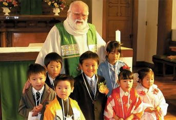 Fr. Barry and young parishioners